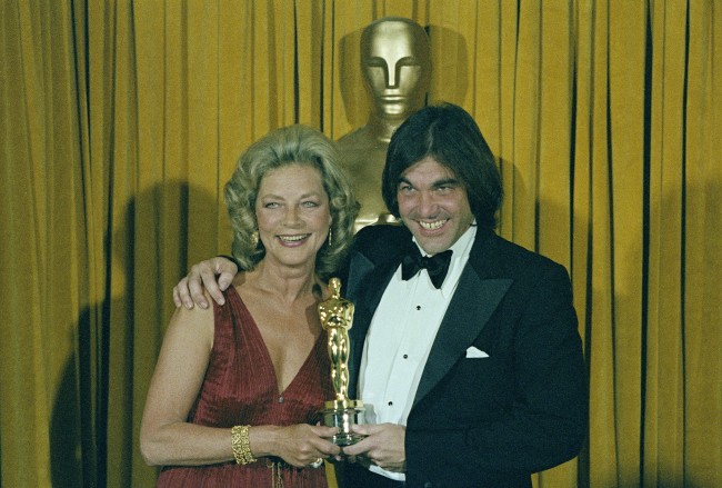 Actress Lauren Bacall is shown presenting Oscar to director Oliver Stone for "Midnight Express" at the 51st Annual Academy Awards in Los Angeles on April 9, 1979. (AP Photo)