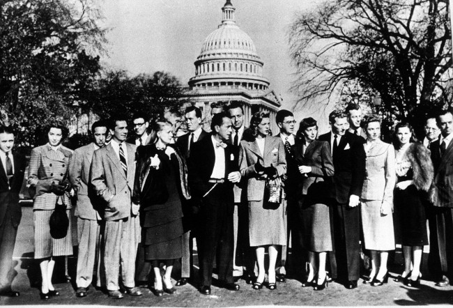 A group of Hollywood stars pose against the Capitol dome as they arrive for a session of the House Un-American Activities Committee in Washington, D.C., Oct. 27, 1947. From left are, Jules Buell, Marsha Hunt, David Hopkins, Richard Conte, Ralph Alswang, June Havoc, John Huston, Sterling Hayden, back, Humphrey Bogart, Paul Henreid, Lauren Bacall, Joseph Sistrom, Evelyn Keyes, Danny Kaye, Sheppard Strudwick, Jane Wyatt, Geraldine Brooks, Ira Gershwin and Larry Adler. (AP Photo) 