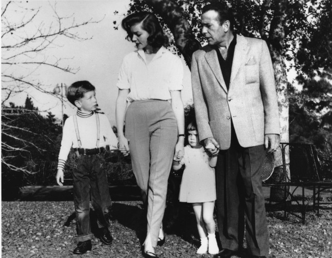 Actor Humphrey Bogart and his wife, actress Lauren Bacall, and their children Stephen, 6, and Leslie, 2, walk on the grounds at their home in Hollywood, Calif., on April 19, 1955