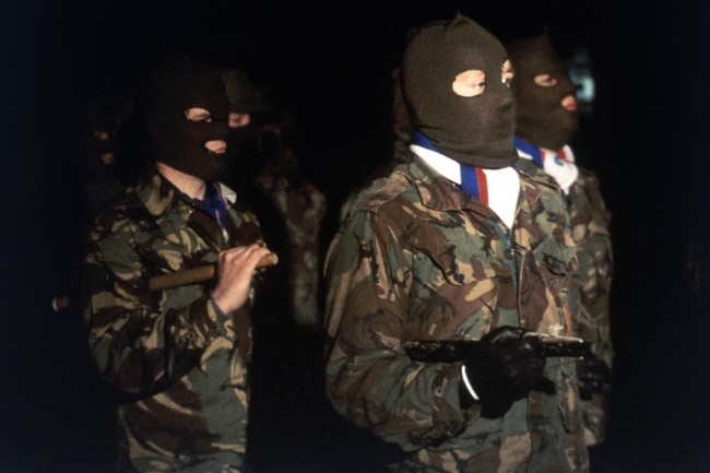 Loyalists armed with cudgels and dressed in combat jackets, who form part of the estimated 20,000 members of the Reverend Ian PaisleyÂs ÂThird ForceÂ, march through the town of Newtonards in Northern Ireland on Nov. 23, 1981, in a show of strength. The British government has declared such Âprivate armiesÂ as illegal. (AP Photo/Peter Kemp) 