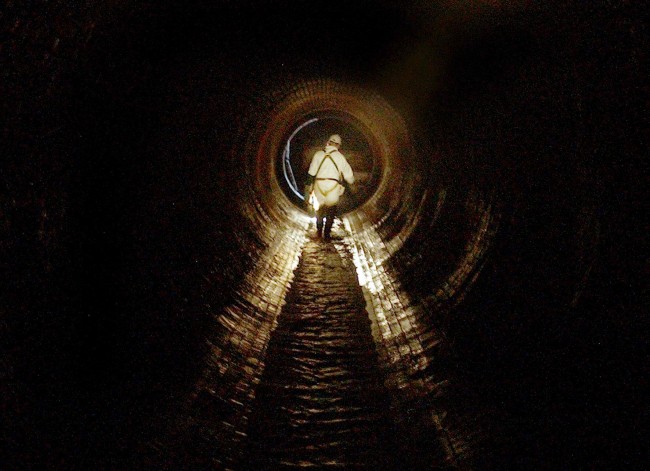 A sewage worker in the victorian sewers under Knightsbridge, west London. 