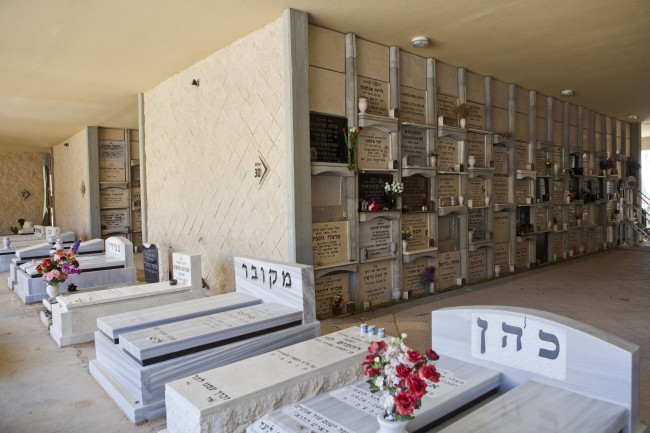 This Monday, Oct. 6, 2014 photo shows a new vertical part of the Yarkon cemetery outside of the city of Petah Tikva, Israel. Cemetery overcrowding is an issue that resonates the world over, particularly in its most cramped cities and among religions that forbid or discourage cremation. After some initial hesitations, and rabbinical rulings that made the practice kosher, Israel's ultra-Orthodox burial societies have embraced the concept as the most effective Jewish practice in an era when most of the cemeteries in major population centers are packed full. (AP Photo/Dan Balilty)