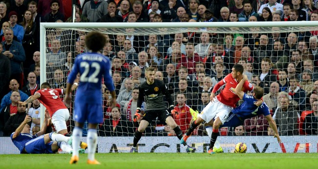 Manchester United's Chris Smalling wrestles with Chelsea's Branislav Ivanovic in the penalty area during the Barclays Premier League match at Old Trafford, Manchester.