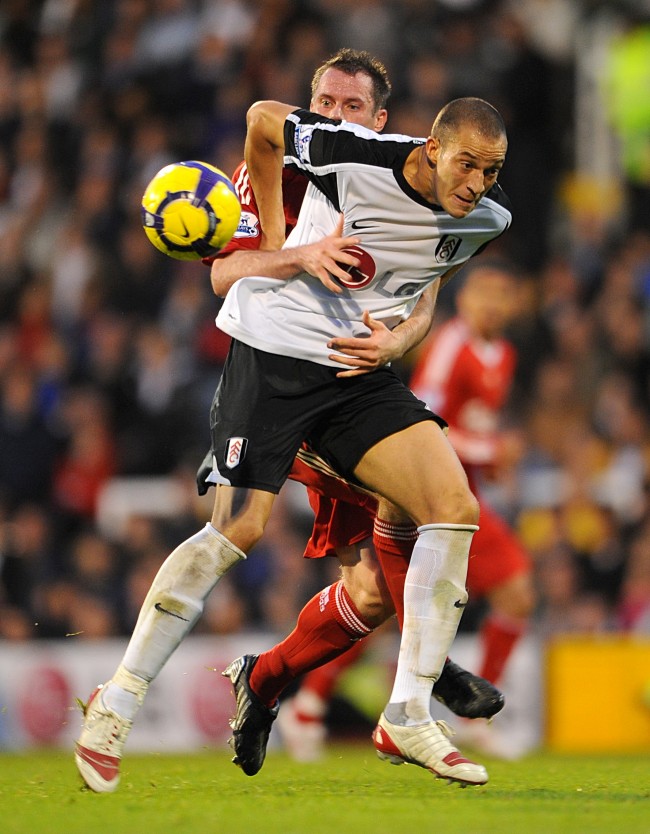 Liverpool's Jamie Carragher brings down Fulham's Bobby Zamora for which he receives a red card Ref #: PA.7982078  