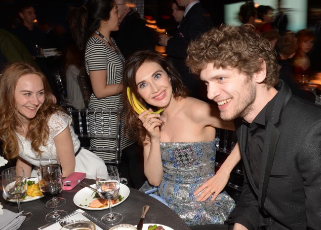 Actress Carice van Houten, center, and friends attend HBO's "Game of Thrones" fourth season premiere after party at the Museum of Natural History on Tuesday, March 18, 2014 in New York. (Photo by Evan Agostini/Invision/AP)