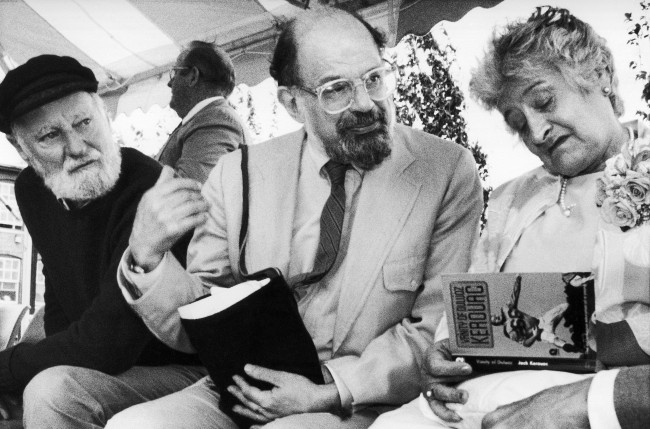 Poets Lawrence Ferlinghetti, left, and Allen Ginsberg look on as Stella Kerouac, right, autographs one of her late husbandÂs books, during the dedication of the Jack Kerouac Commerative, a work of public art in Lowell, Massachusetts historic district Saturday, June 25, 1988. 