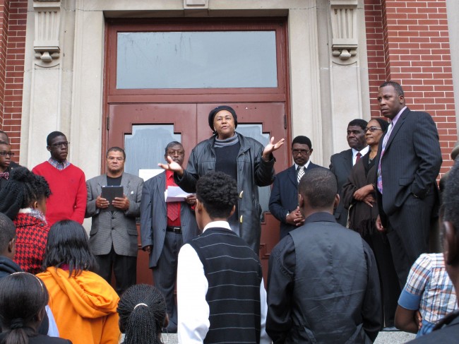 George Stinney's second cousin Irene Lawson-Hill, center, tells a crowd her family won't stop fighting, at a rally to call for justice for George Stinney on Tuesday, Dec. 10, 2013, in Manning, S.C. Stinney was 14 in 1944 when South Carolina executed him for killing two white girls. Supporters say there is no evidence against Stinney. (AP Photo/Jeffrey Collins)