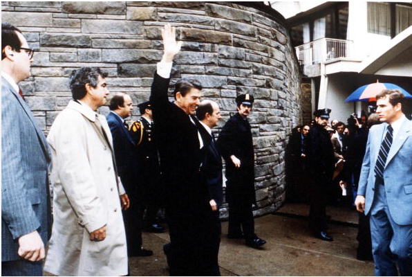 resident Ronald Reagan Waves To Onlookers Moments Before An Assassination Attempt By John Hinckley Jr March 30, 1981 By The Washington Hilton In Washington Dc.James Brady Is Visible Third From The Left.