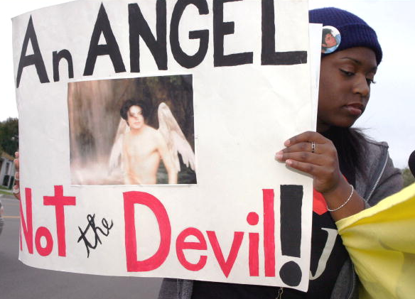 Michael Jackson supporter, Olivia Baker, 20, of San Diego, holds a sign outside the courthouse at Michael Jackson's preliminary hearing on February 13, 2004 in Santa Barbara, California.