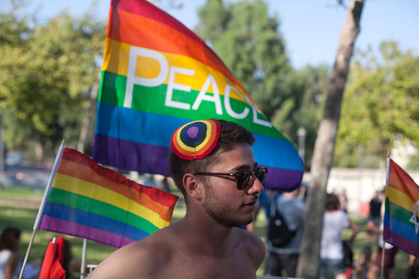 JERUSALEM, ISRAEL - JULY 30:  Israelis participate in the Gay Pride Parade on July 30, 2015 in Jerusalem, Israel. At least six people were stabbed at Jerusalem's annual Gay Pride Parade on Thursday. The assailant, an ultra-Orthodox Jew, emerged behind the marchers and began stabbing them while screaming. A police officer then managed to tackle him to the ground and arrest him.  (Photo by Lior Mizrahi/Getty Images)
