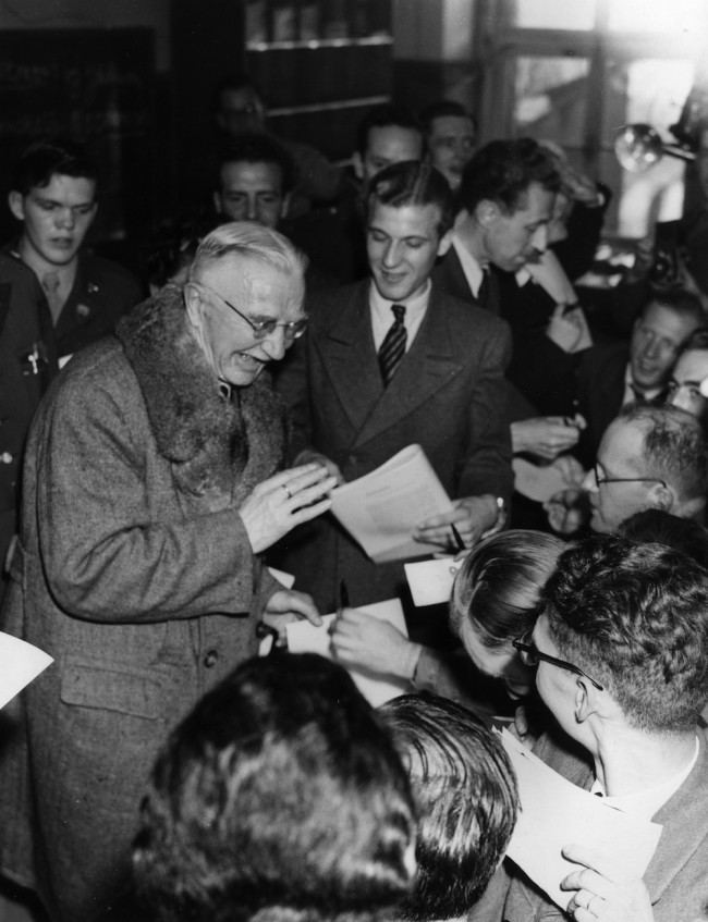 2nd October 1946:  German financier Hjalmar Schacht signing autographs after he was acquitted at the Nuremberg war trials.  (Photo by Fred Ramage/Keystone/Getty Images)