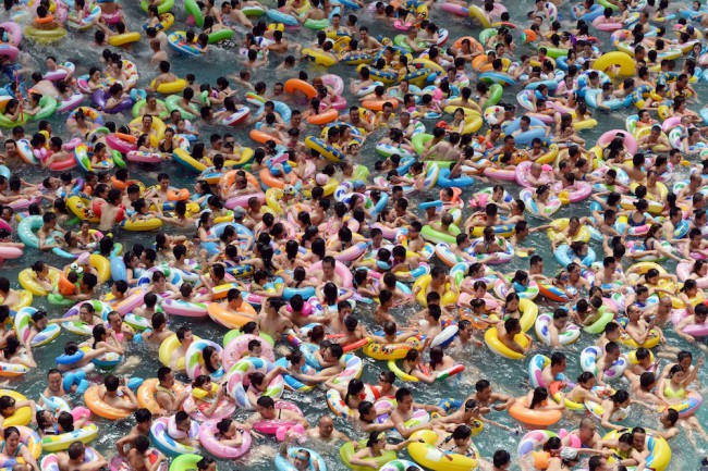  Visitors crowd at Chinese Sea of Death tourist resort in Daying County to escape high temperature on July 11, 2015 in Suining, Sichuan Province of China. Most parts in China ushered in hot weather in July and more than eight thousand visitors from every corner of China crowded to China Sea f Death to enjoy the cool. (Photo by ChinaFotoPress/Getty Images)