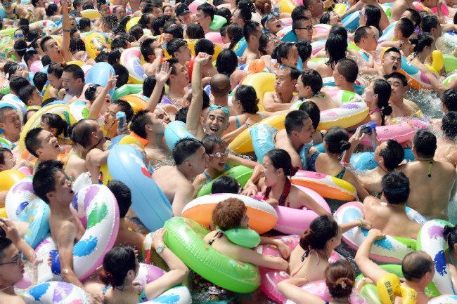  Visitors crowd at Chinese Sea of Death tourist resort in Daying County to escape high temperature on July 11, 2015 in Suining, Sichuan Province of China. Most parts in China ushered in hot weather in July and more than eight thousand visitors from every corner of China crowded to China Sea f Death to enjoy the cool. (Photo by ChinaFotoPress/Getty Images)