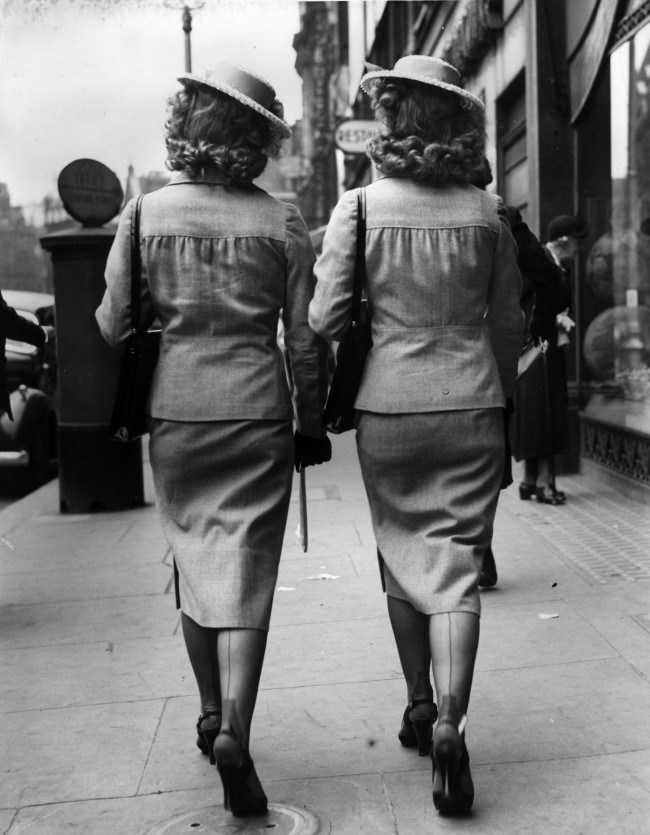 27th May 1939:  The Henderson twins of radio and music-hall fame on a shopping expedition in Shaftsbury Avenue, London.  (Photo by A. J. O'Brien/Fox Photos/Getty Images)
