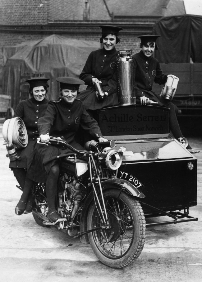 circa 1925:  Women of Achille Serre Ltd's Private Fire Brigade setting off on their motorcycle and sidecar to compete in the London Private Fire Brigades' Tournament. They are defending champions in the women's events.  (Photo by Hulton Archive/Getty Images)