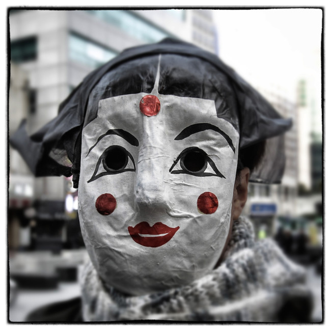 SEOUL, SOUTH KOREA - DECEMBER 05: (EDITORS NOTE: Image was altered with digital filters.) A protester wearing a mask during the anti-government rally on December 5, 2015 in Seoul, South Korea. Demonstrators gathered on the streets of Seoul to protest against the government's decision to adopt new history textbooks and reform the labor market. Liberal civic groups decided to proceed the protest in the central Seoul despite a prohibition order from the police. (Photo by Chung Sung-Jun/Getty Images)