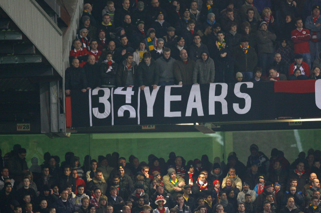 MANCHESTER, ENGLAND - JANUARY 27: Manchester United fans display a banner taunting Manchester City during the Carling Cup Semi Final second leg match between Manchester United and Manchester City at Old Trafford on January 27, 2010 in Manchester, England. (Photo by Alex Livesey/Getty Images)