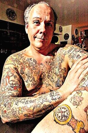  56, of Bethlehem, Pennsylvania is erasing the 2200 Disney tattoos that 