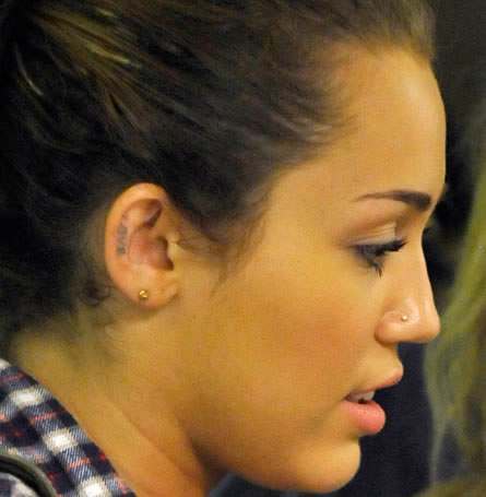 Star Tattoos In The Ear. MILEY Cyus is the teen star