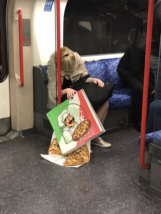 Anorak News | This photo of a sleeping woman dropping her pizza on the