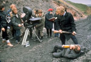 Closing scene at Blackhall Beach. Ian Hendry with Michael Caine and crew.